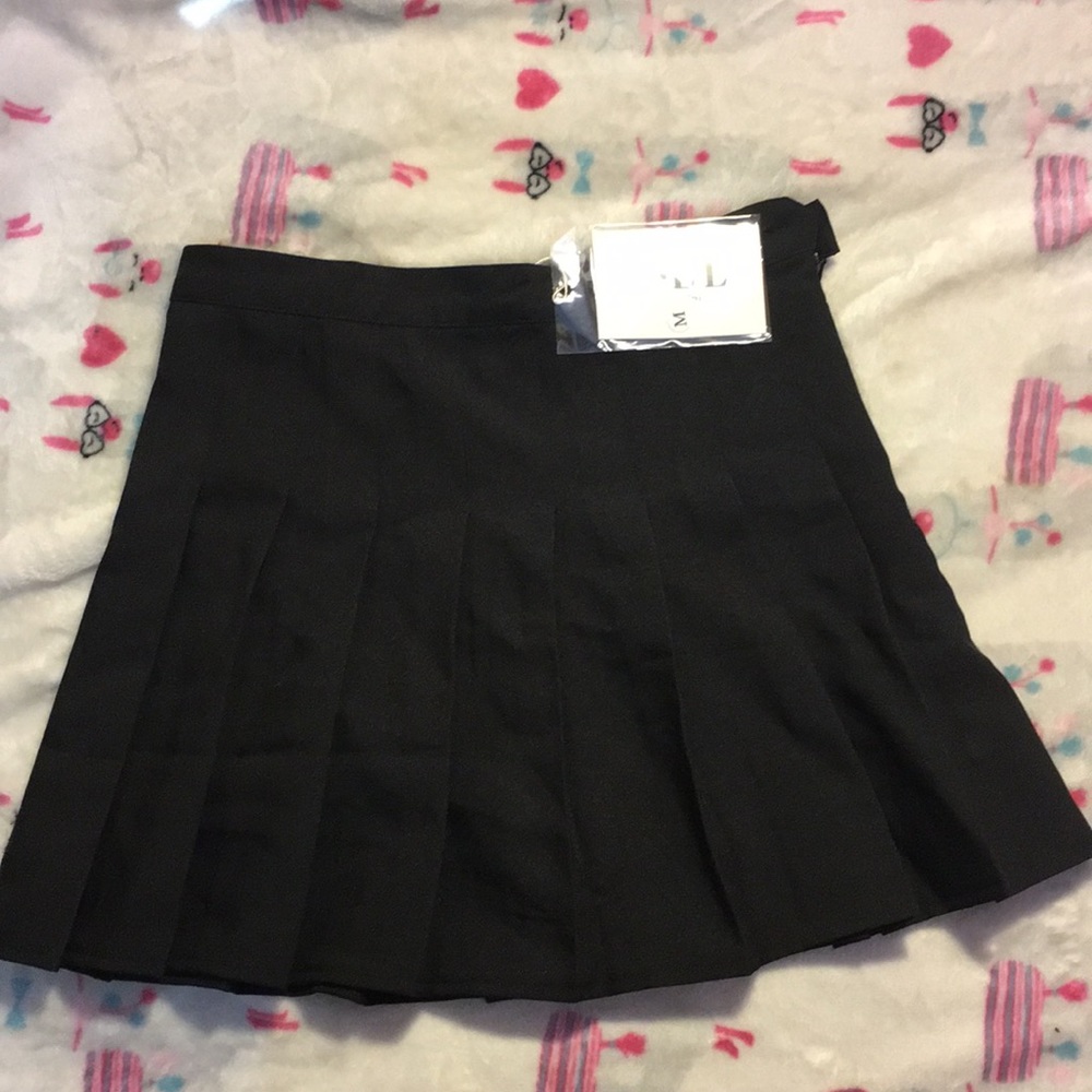 A black, pleated mini skirt.